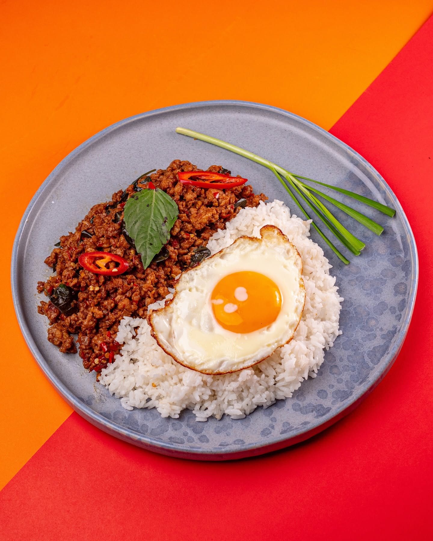 Pad Kra Pao: minced pork with holy basil, chili and a crispy fried egg over jasmine rice